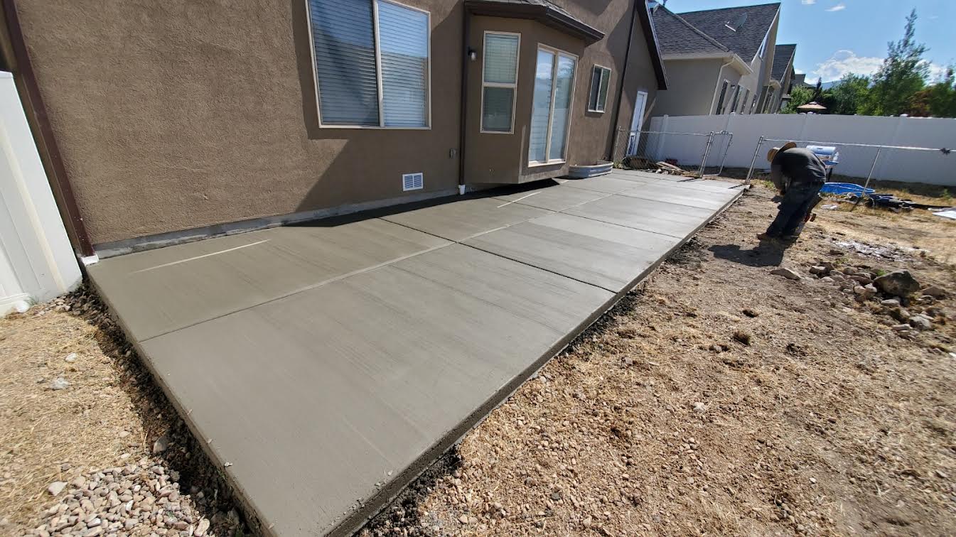 Freshly poured concrete walkway alongside home in Utah